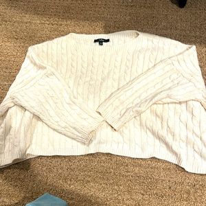 Cream colored women’s cropped oversized sweatshirt